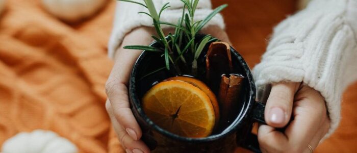 Close Up of Woman Hands Holding Tea Cup by Karolina Grabowska